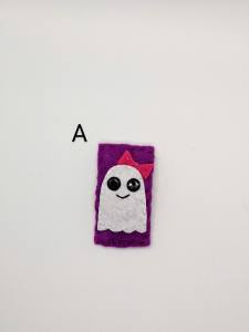 smiling ghost with bow on purple background
